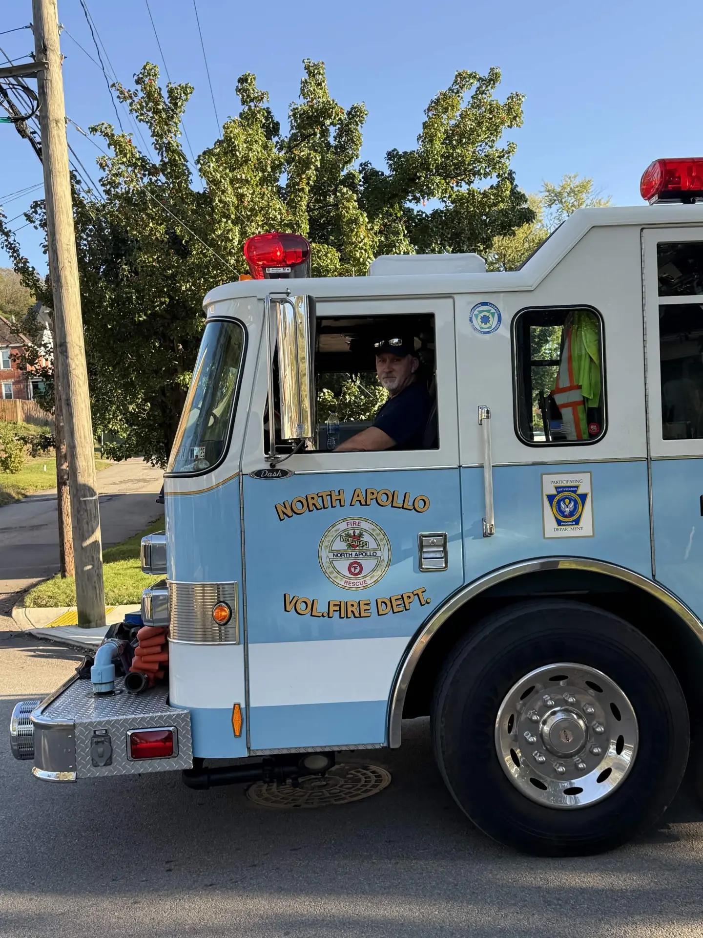 A firefighter behind the wheel of the department's Pierce engine