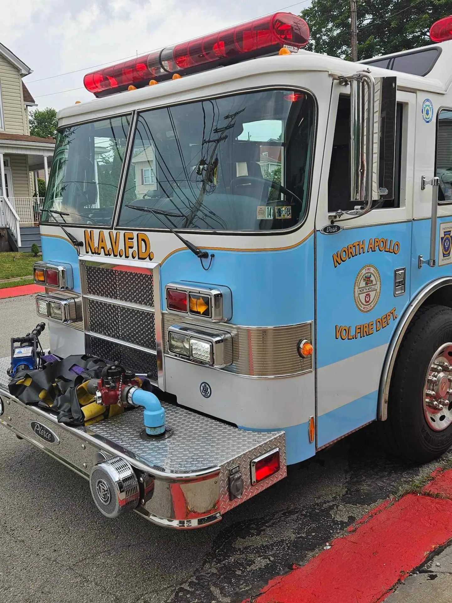 Front view of the department's light blue and white Pierce engine
